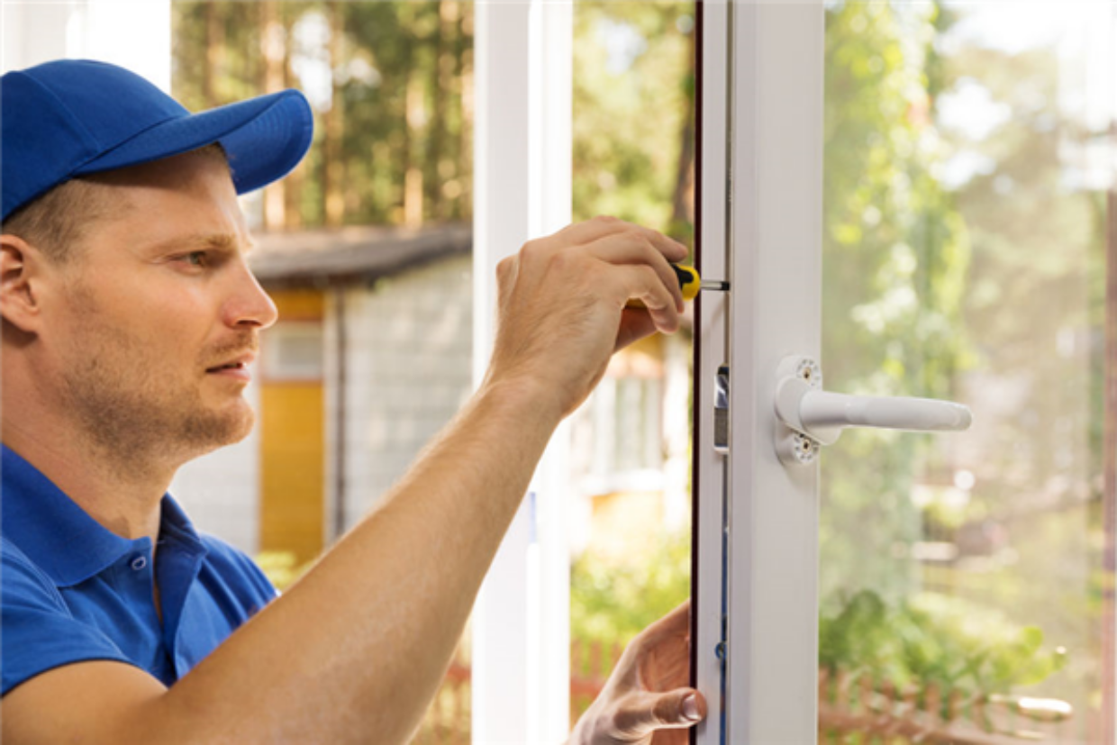 handyman finalizes installation of new exterior door